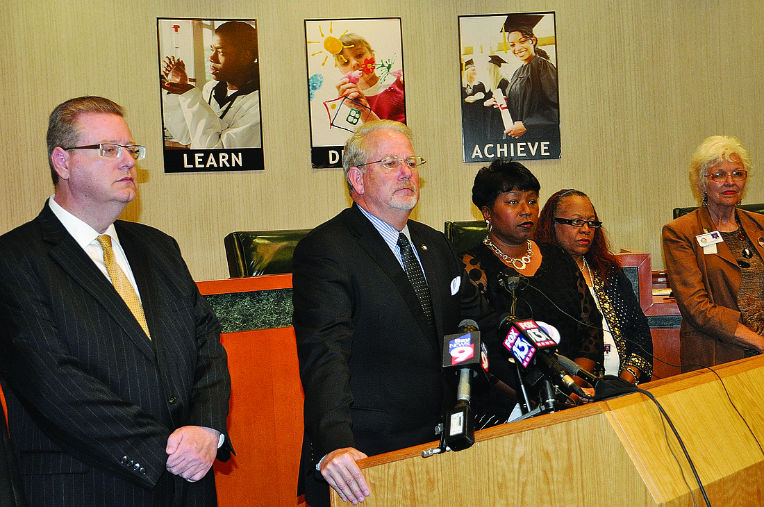 Superintendent Rick Mills, center, flanked by his senior leadership team at a press conference Friday, said the school district remains upbeat about the future. Photo by Josh Siegel