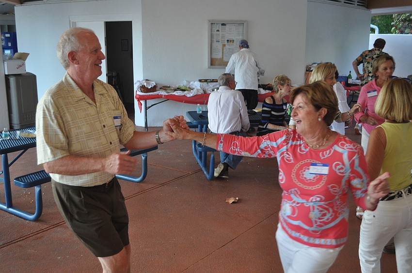Cathy and Ed Ryan dance as Ben Hammond croons
