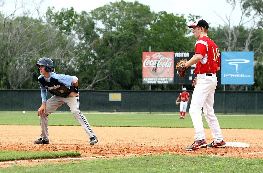 Out-of-Door Academyâ€™s Jimmy Kuebler, No. 2, leads off first while Cardinal Mooneyâ€™s Flynn Angly, No. 18, stays close.