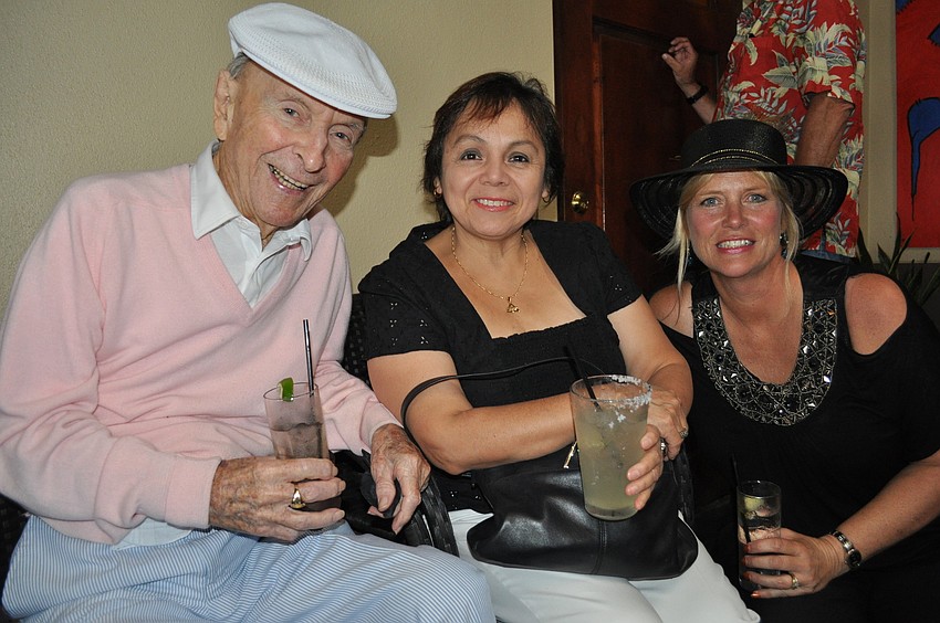 97-year-old Roy Perry with his caretaker, Iris Valencia, and his neighbor, Camille Heltman