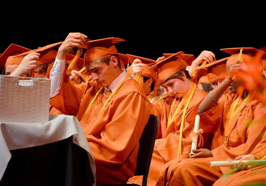 Seniors move their tassels.