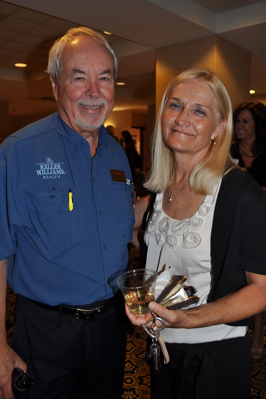 Richard Curtis, of Keller Williams, with Debbie Lamb, of Signs Now
