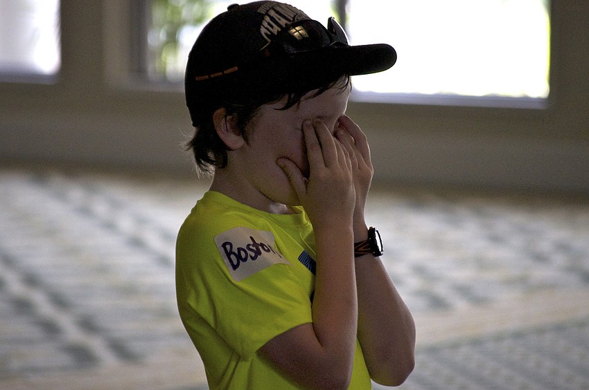 Boston McDougall covers his eyes â€” itâ€™s his turn to be â€œit.â€