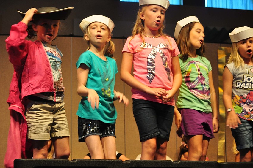 Sailors Meredith Beck, Emily Perkins, Grace Smith, Brianna Barbosa and Reagan Caffrey man their boat.