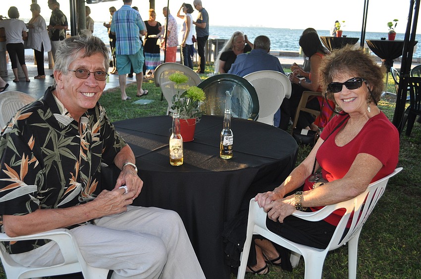 Gary Leatherman and Ann Hankinson sit in the shade