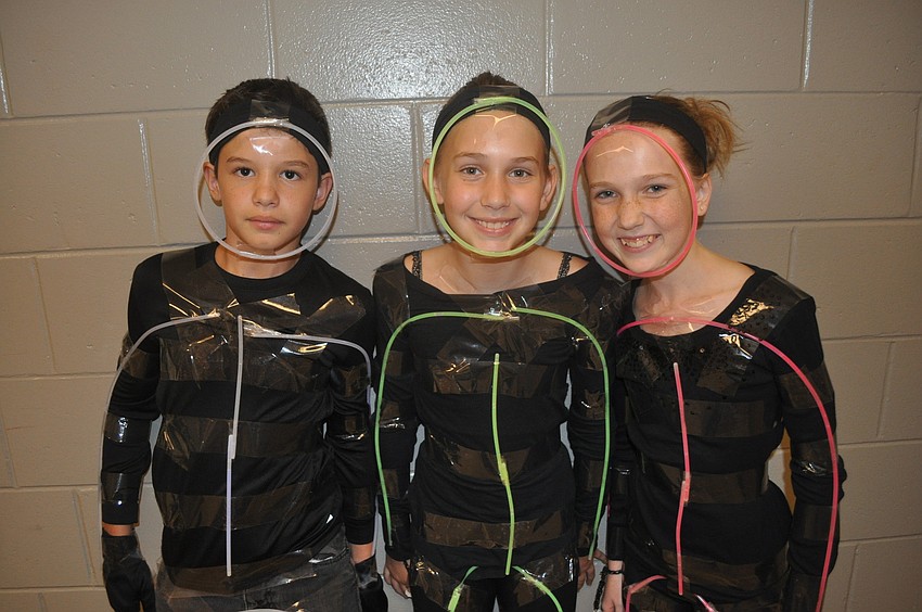 Connor Kirk, Kat Daniel and Lily Adamson performed a glow stick dance.