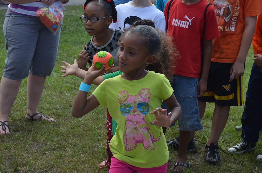 Lyric Willis tries to dunk a teacher.