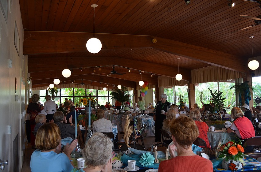 The party was held at the Sarasota Garden Club and had fourteen themed tables