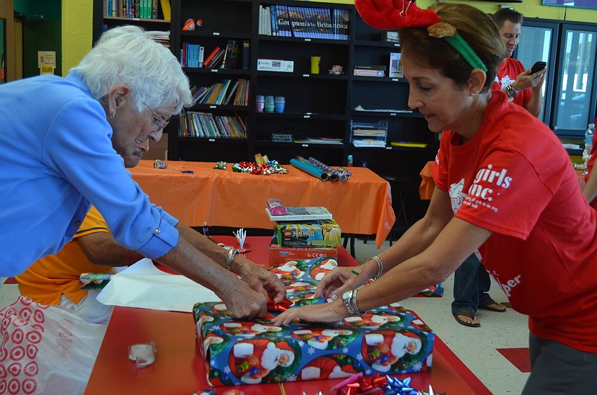 Marie Corsi and Patti Eisemann work together