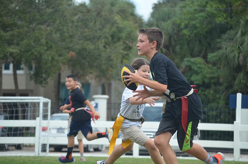 Kevin O. runs with the ball