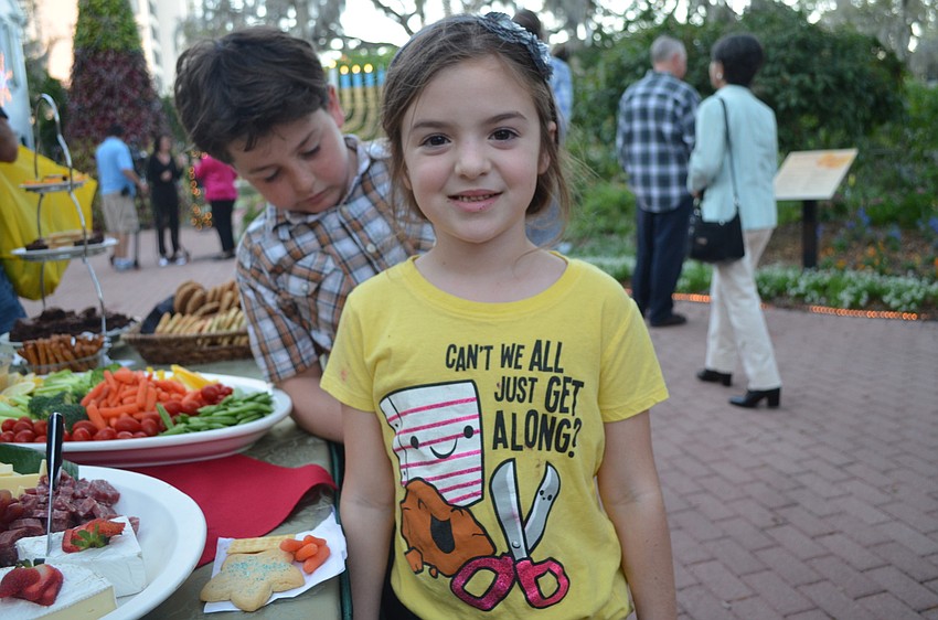 Luci Perales enjoys a cookie.