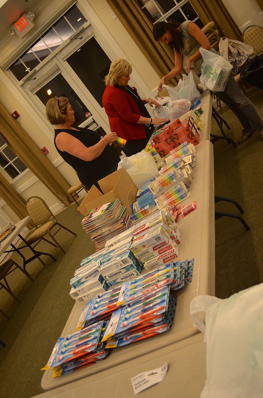 Volunteers form an assembly line in hopes of faster production.