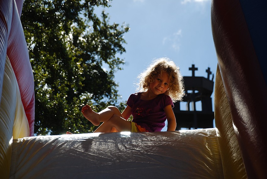 Avery Rann at the top of the bouncy slide