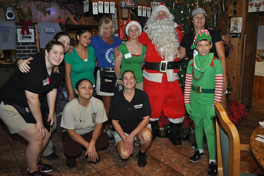 The parade's Santa Claus visits Linger Lodge staff before leaving.