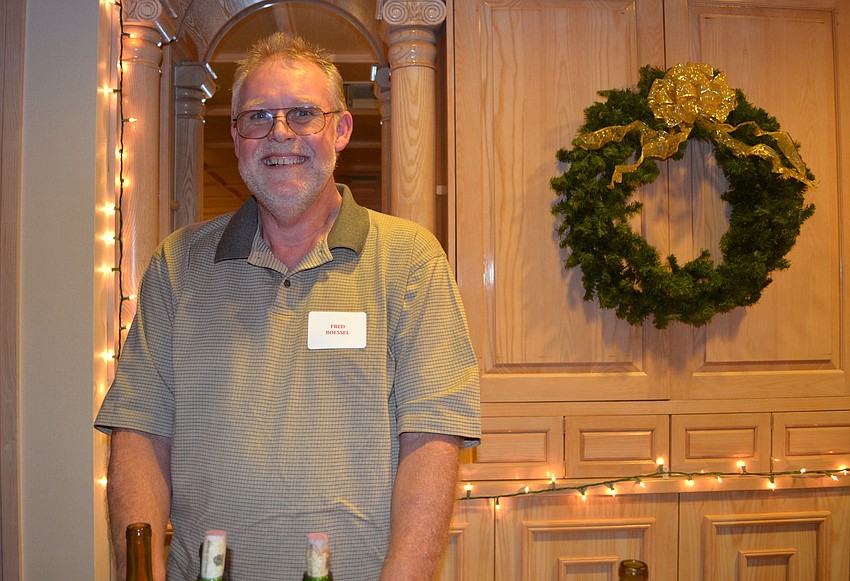 Fred Boessel acts as bartender for the evening.