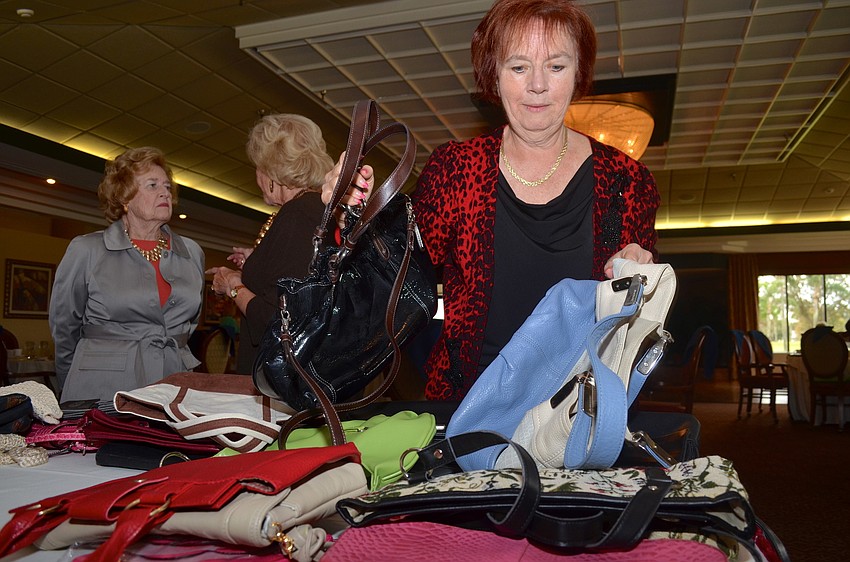 Meg Garofalo peruses her choices to bid on later.