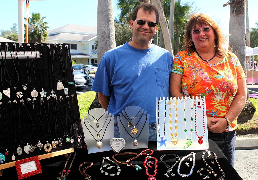 Sal and Linda Rizzo stand at their booth, Lindaâ€™s Creative Side.