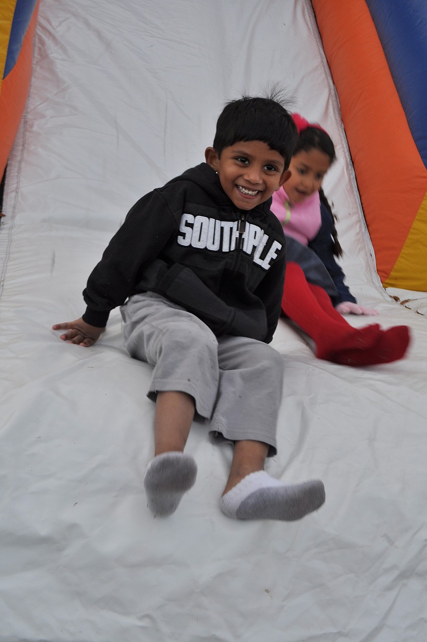 Samik Choudhury, 4, canâ€™t get enough of the slide.