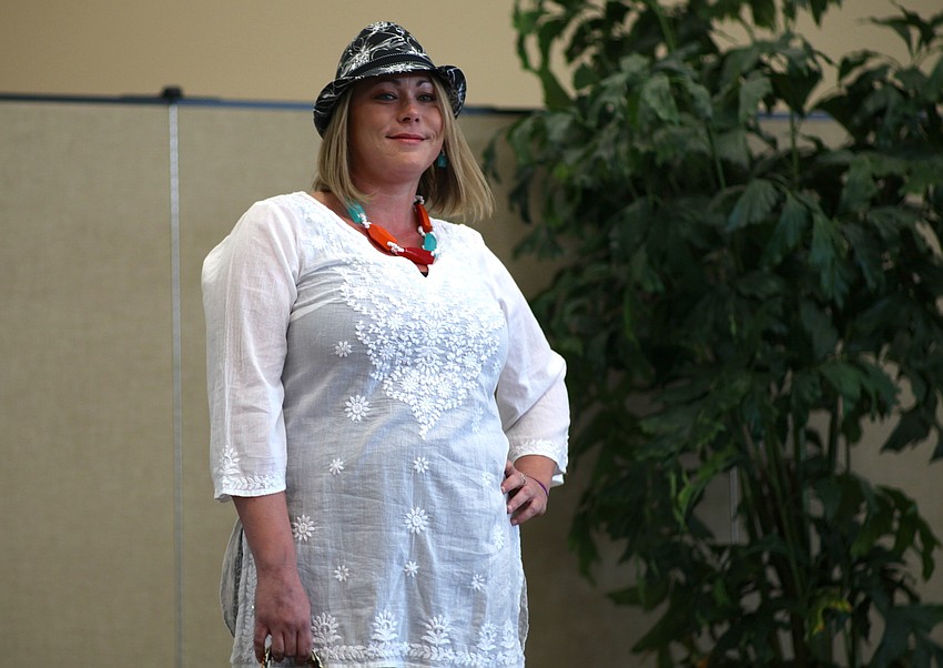 Stephanie Lund sports a beachy white tunic.