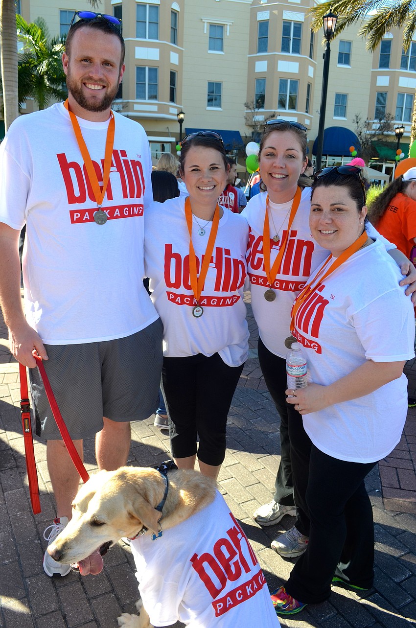 Brett Blyholder, Pamela Chiappone, Tiffany Masto and Alicia Pucci pose with their team mascot, Beau.
