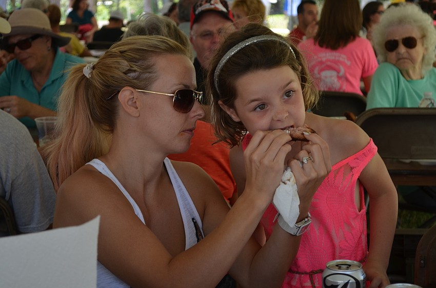 Catherine McDonnell helps daughter, Francesca, keep her hands clean.