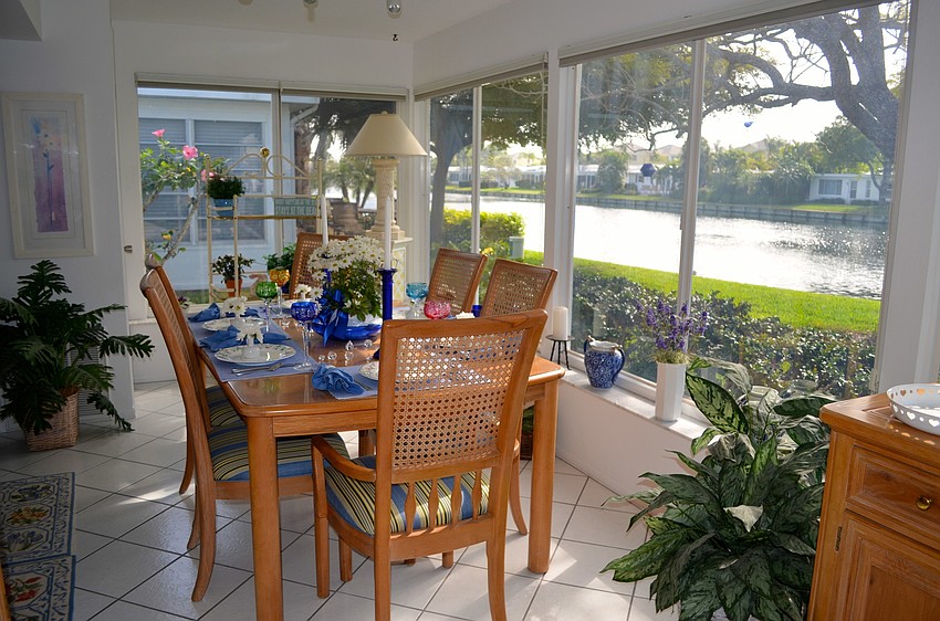 The dining room table has a perfect view of the lake.