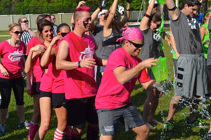 The pink team works to finish the event first.