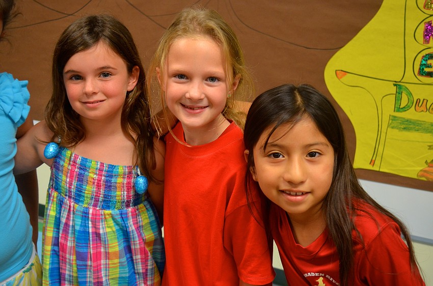 Megan Bovaird, Carol Lebon and Sofia Garcia helped narrate and create props for the play.
