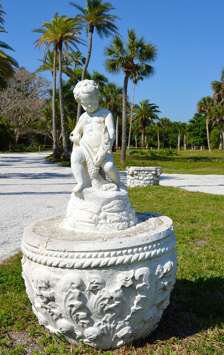 A statue stands at the front of the property.
