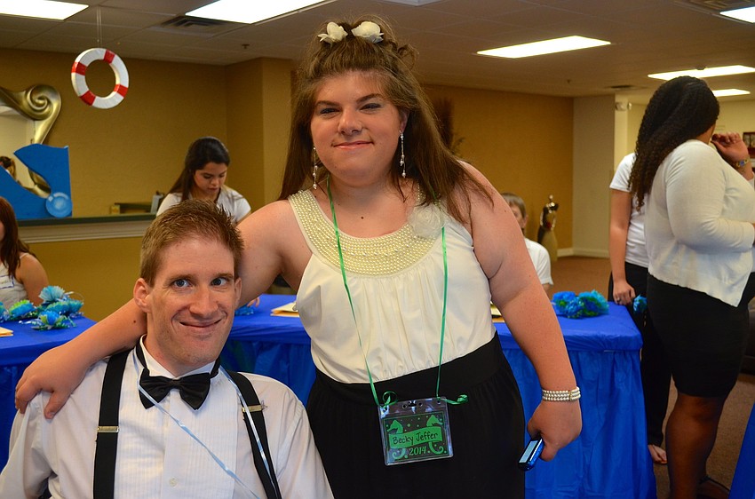 Michael Motycka and Becky Jaffer show off their formal attire.