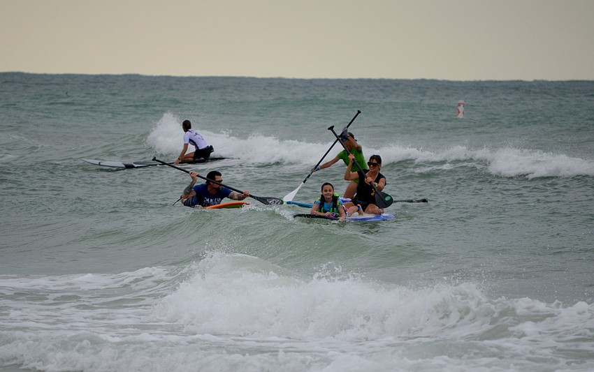 Competitors faced rough waters in the inaugural paddle race.