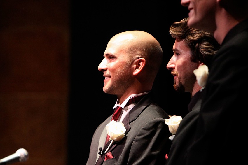 Joseph Sckowska tries to get a look at his bride as she makes her way down the aisle Sunday, April 21.