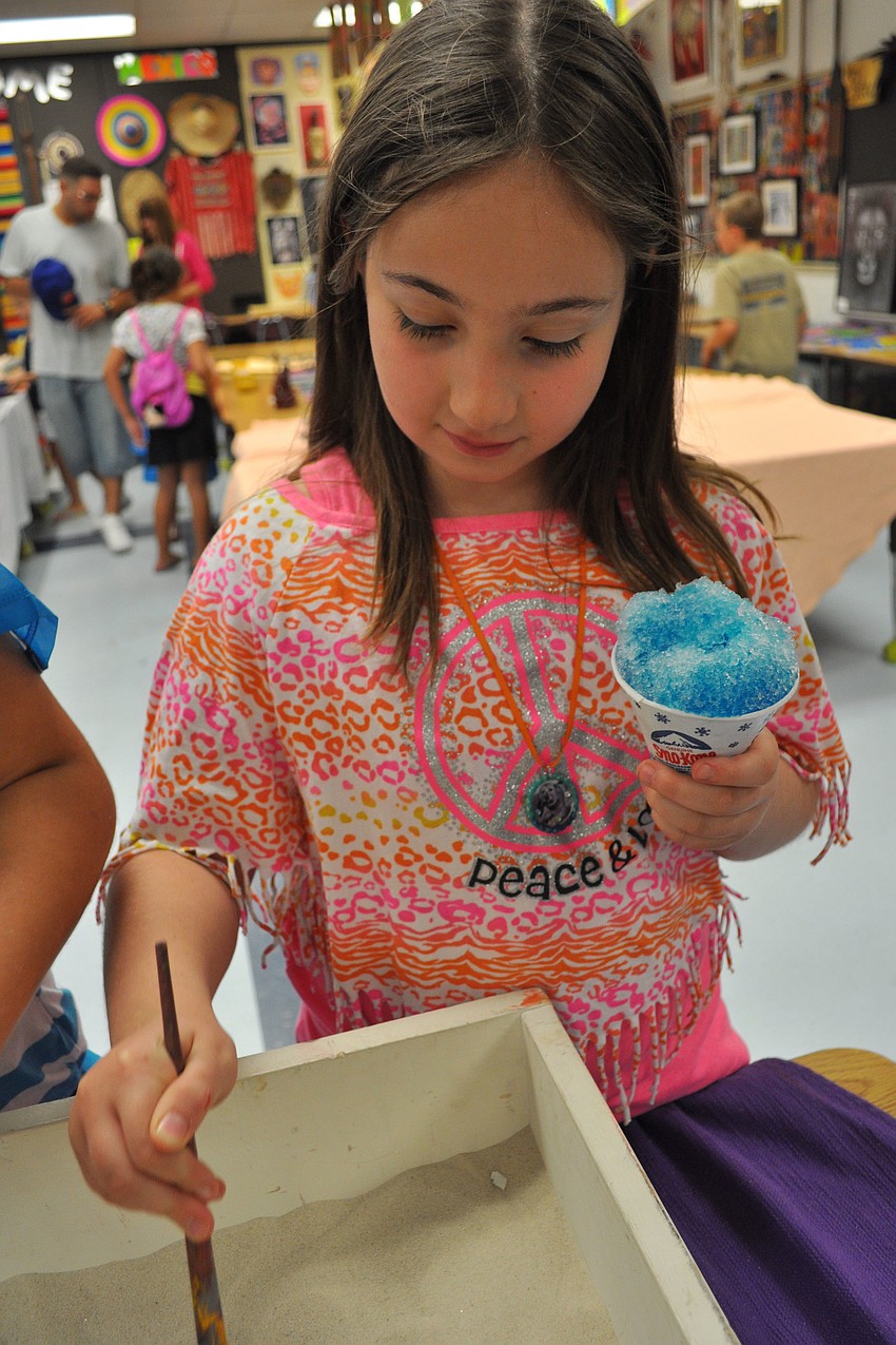 Delaney Mubara, 10, hunted for a foreign coin.