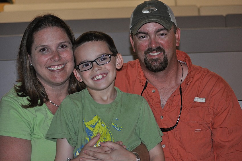 Carol Ricks, a Gene Witt first grade teacher, with her son, Matthew, and husband, Rey