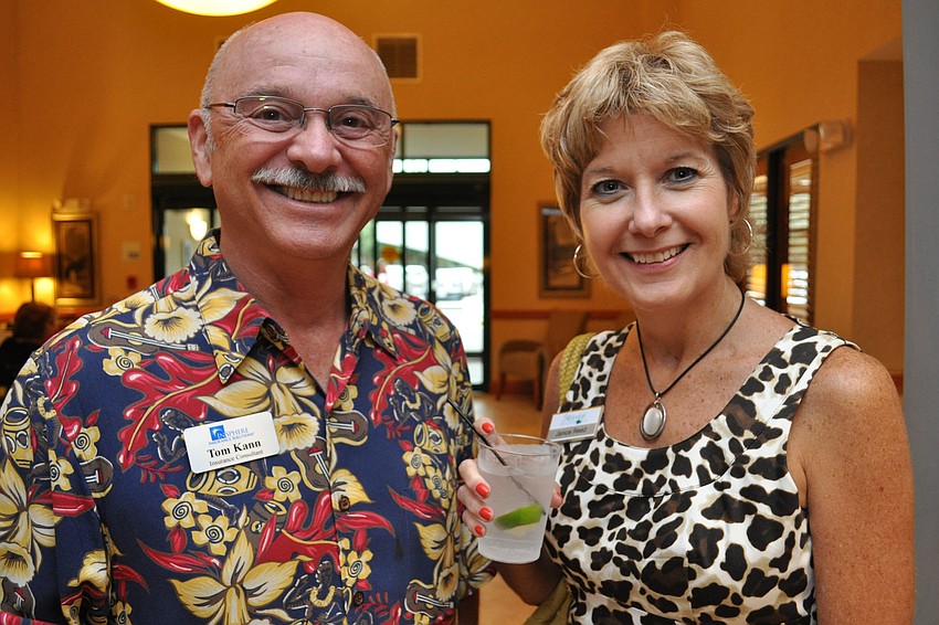Tom Kann, of Insphere Insurance Solutions, with Janice Reed, of Waterlefe Golf & River Club