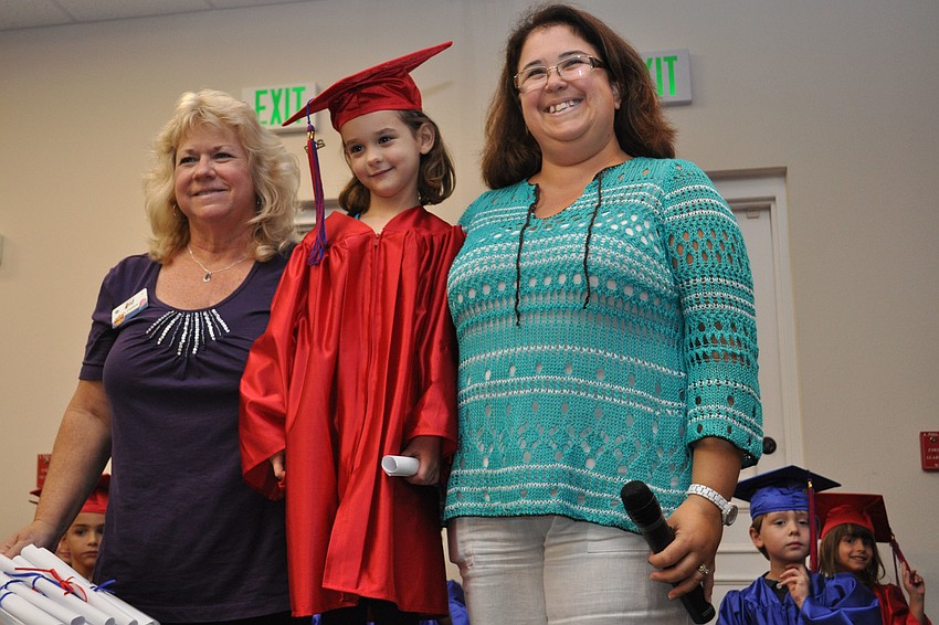 Natalia Chadbourne, center, posed for a picture with her Kiddie Academy teachers, Debbie Frazzoni, left, and Karen Kieran, right, after receiving her diploma.