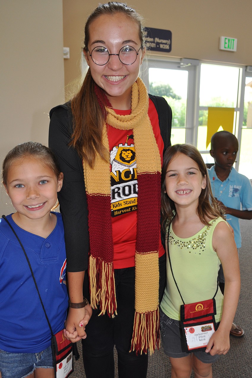 Leader Emily Lacina, center, dresses as Harry Potter for 