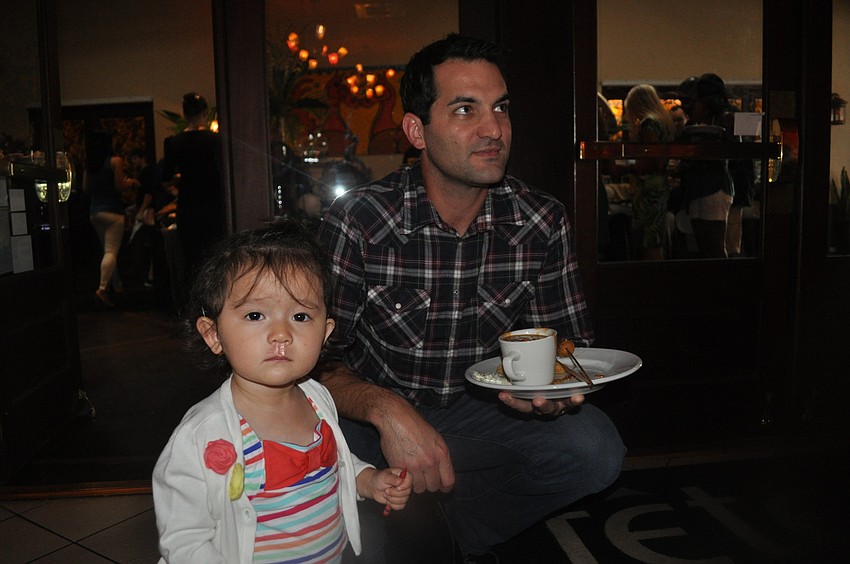 Madison Derakhshan and her father, Mike, took in the music.