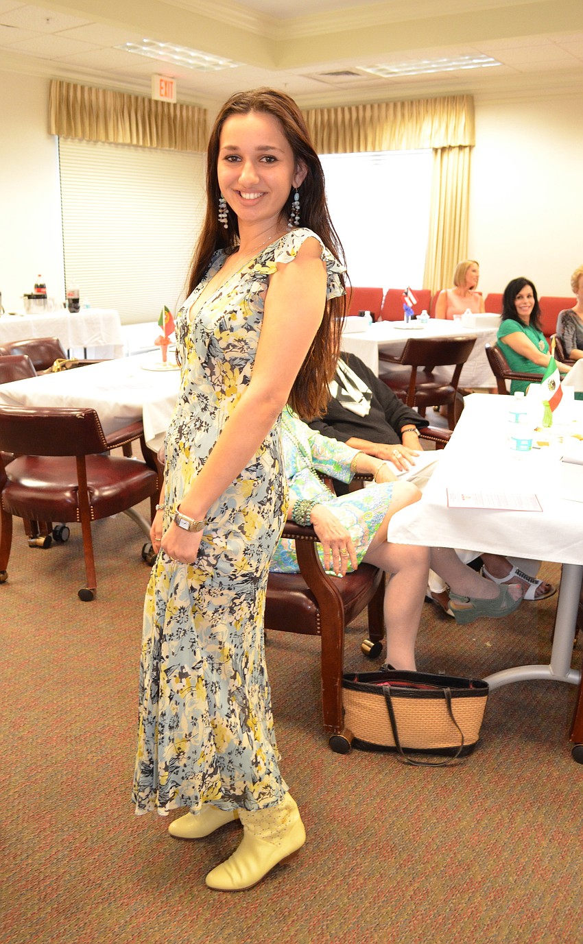 Eve Day models a fabulous dress paired with cowboy boots.