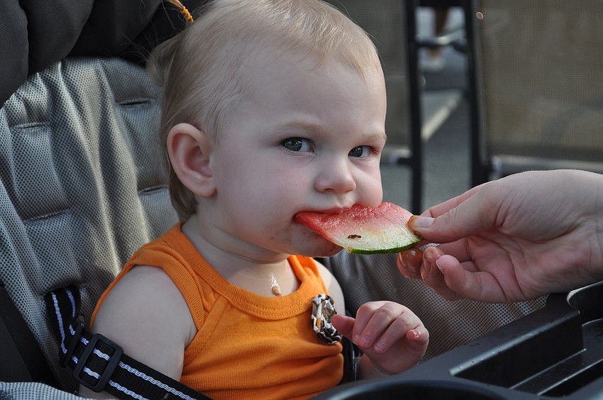 Lauren Tichy eats the watermelon that came on one BBQ dish