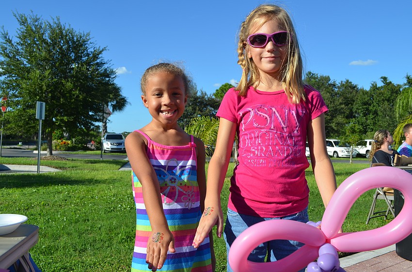 Megan Mischak and Bridgette McGraw show off their fresh tattoos.