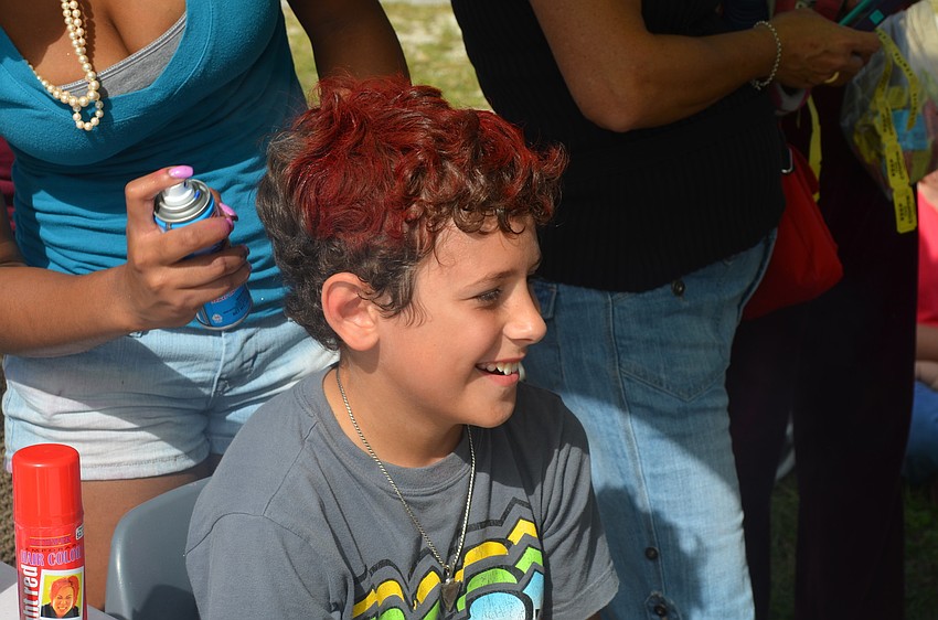 Sullivan Henry has his hair colored.