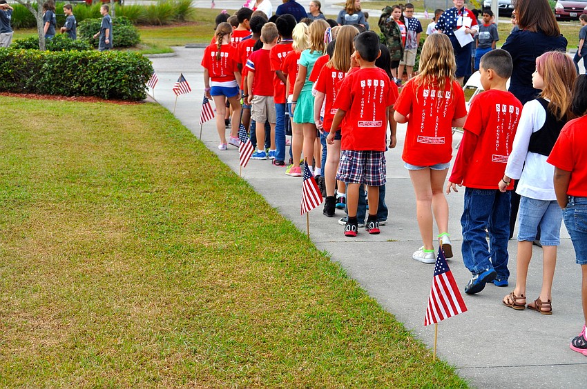 Students file out to the courtyard for the second part of the celebration.