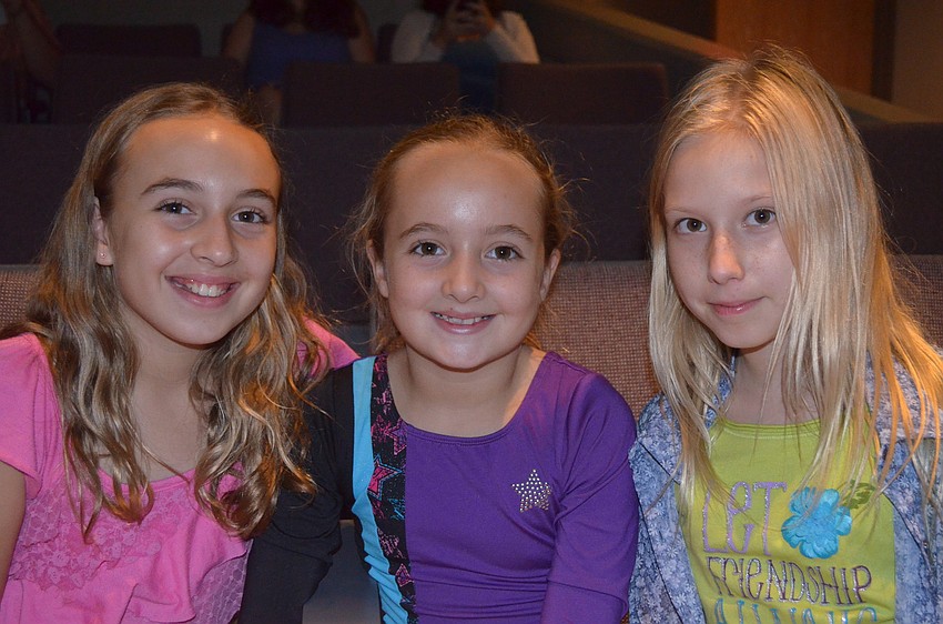 Elizabeth and Sarah Riley with Lindsey Wolf support their sisters from Sarasota Middle and Riverview.