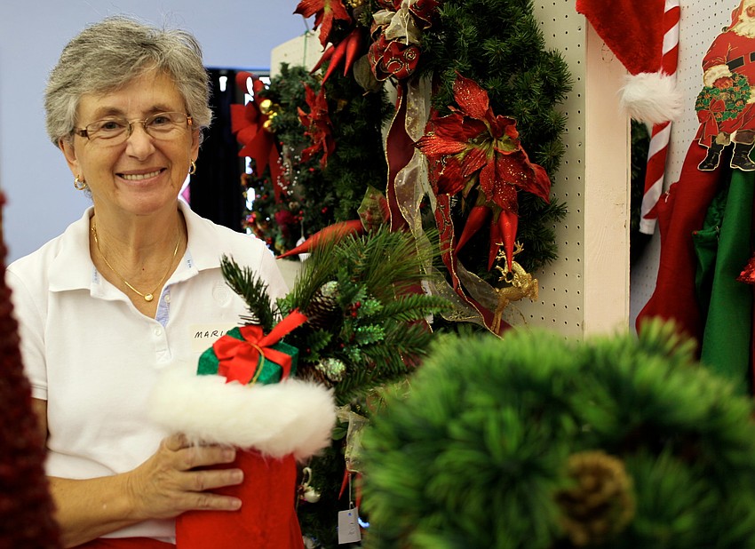 Marie Sangiorgio helps around tree area of the bazaar.