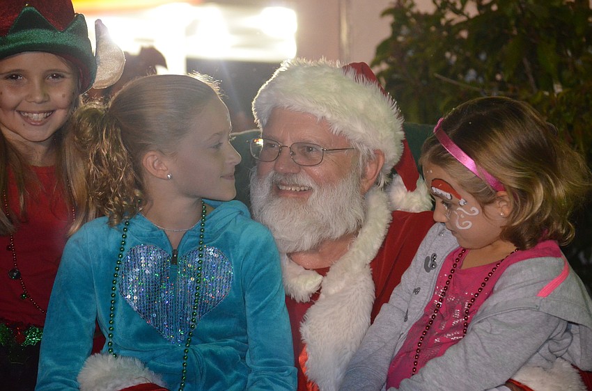 Kaylee Dutkiewicz and Jaiden Beachy sit on Santaâ€™s lap.