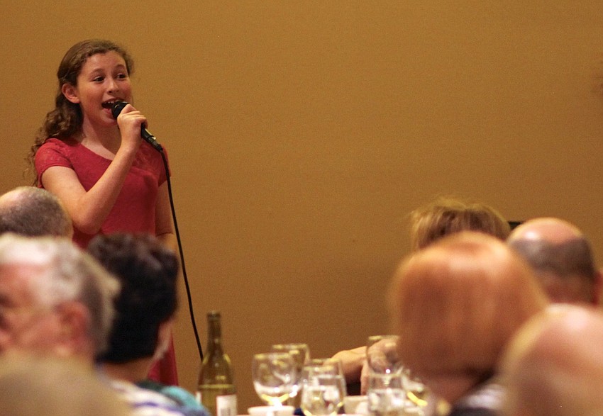 Emma Katz entertains the crowd with a song.