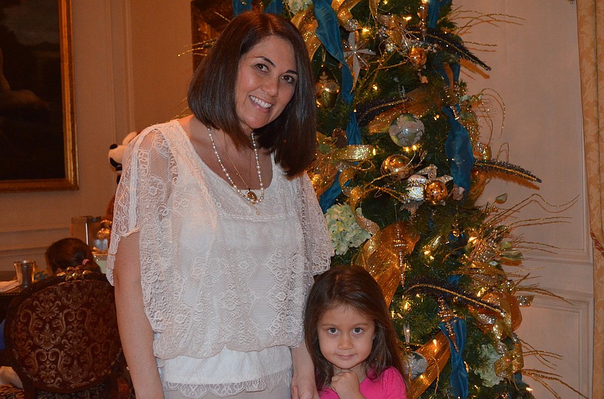 Jennifer Gilmour and daughter Kiana patiently wait for Santa