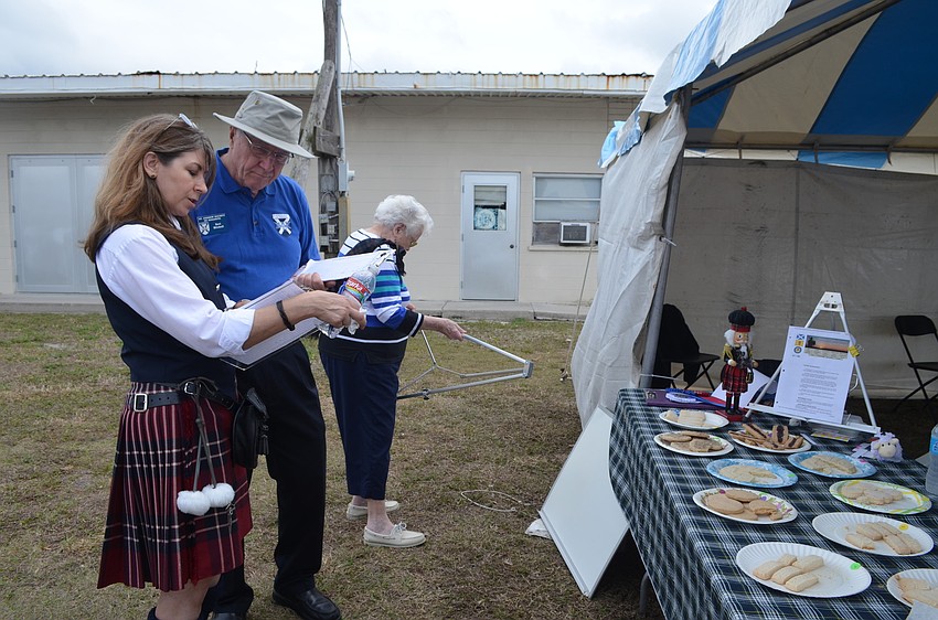 Nancy Love and Bert Mitchell judge the short bread.