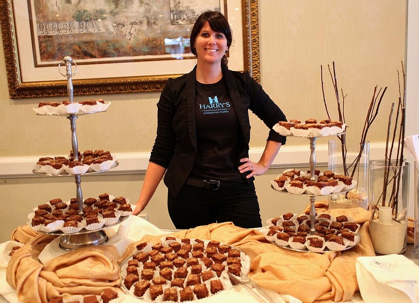 Paula Wright hands out sweet treats from Harryâ€™s Continental Kitchen.